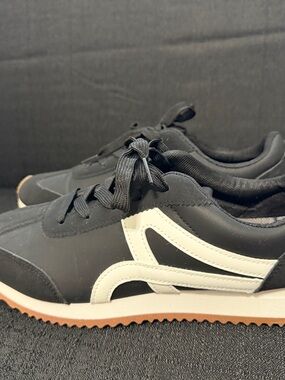 Black Sneakers with White Wave Accent